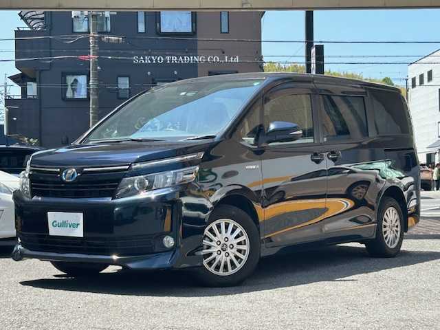 トヨタ ヴォクシー ハイブリッド X 静岡県 2016(平28)年 8万km ブラッキッシュアゲハガラスフレーク ワンオーナー/純正ナビ/ワンセグTV/CD/SD/BT/バックカメラ/両側パワースライドドア/プリクラッシュセーフティ/レーンキープアシスト/オートハイビーム/前後ドライブレコーダー/LEDヘッドライト/ビルトインETC/純正15インチAW/スマートキー×2/保証書/取扱説明書/ナビ取扱説明書/R1/3/4点検記録簿有