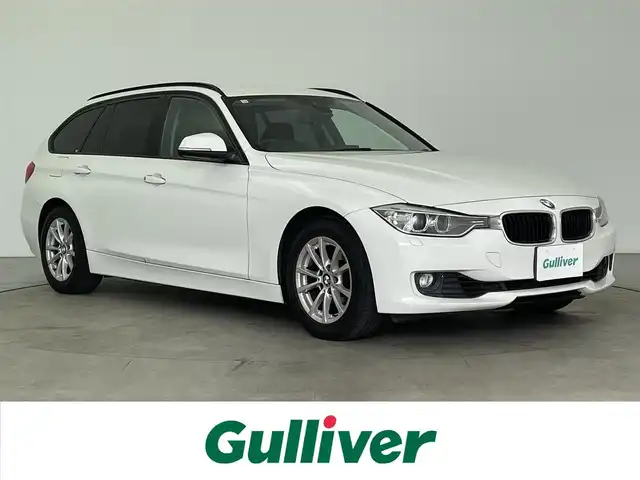 ＢＭＷ ３２０ｉ ツーリング 大分県 2014(平26)年 5万km アルピンホワイトⅢ 純正ナビ/（Bluetooth/AM/FM/CD/DVD)/バックカメラ/パワーバックドア/衝突軽減ブレーキ/レーンキープアシスト/前席パワーシート/ETC/ステアリングスイッチ/純正アルミホイール/MT付きAT/走行モード切替/（コンフォート/ECOPRO/sports）/保証書・取扱説明書