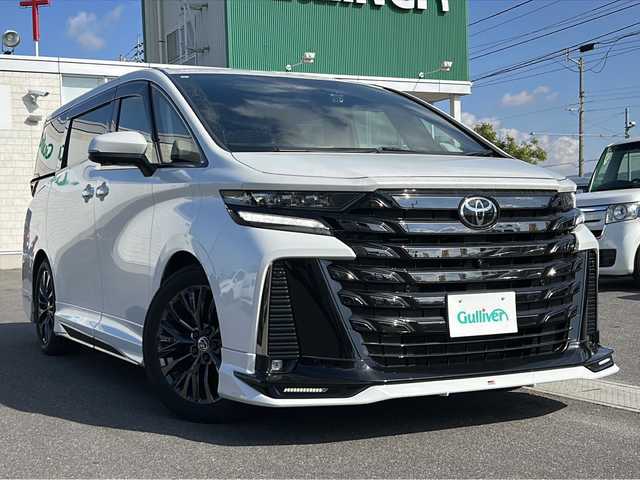 トヨタ ヴェルファイア ハイブリット Z プレミア 香川県 2023(令5)年 6.7万km プラチナホワイトパールマイカ 純正14インチHDディスプレイオーディオPlus（フルセグTV/BT)/アラウンドユーモニター/ブラインドスポットモニター/デジタルインナーミラー/後席モニター/ドライバーモニター/純正GRエアロ（フロント，サイド，リア）/両側パワースライドドア/サンルーフ/3列シート/電動リアゲート/ドライブレコーダー/パワーシート/シートヒーター/エアシート/コーナーセンサー/オートマチックハイビーム/シートメモリー/社外マフラー/ビルトインETC2.0