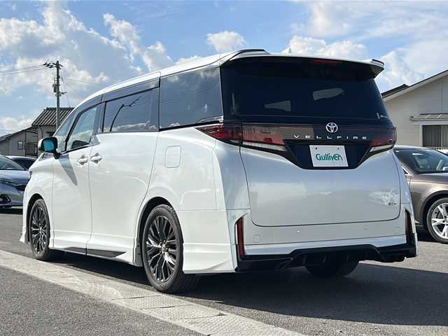 トヨタ ヴェルファイア ハイブリット Z プレミア 香川県 2023(令5)年 6.7万km プラチナホワイトパールマイカ 純正14インチHDディスプレイオーディオPlus（フルセグTV/BT)/アラウンドユーモニター/ブラインドスポットモニター/デジタルインナーミラー/後席モニター/ドライバーモニター/純正GRエアロ（フロント，サイド，リア）/両側パワースライドドア/サンルーフ/3列シート/電動リアゲート/ドライブレコーダー/パワーシート/シートヒーター/エアシート/コーナーセンサー/オートマチックハイビーム/シートメモリー/社外マフラー/ビルトインETC2.0
