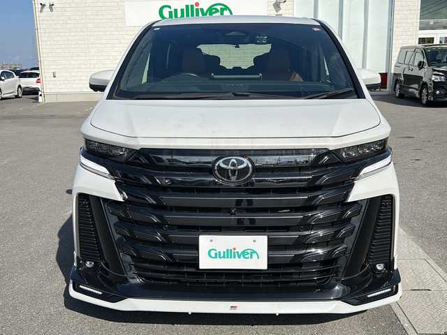 トヨタ ヴェルファイア ハイブリット Z プレミア 香川県 2023(令5)年 6.7万km プラチナホワイトパールマイカ 純正14インチHDディスプレイオーディオPlus（フルセグTV/BT)/アラウンドユーモニター/ブラインドスポットモニター/デジタルインナーミラー/後席モニター/ドライバーモニター/純正GRエアロ（フロント，サイド，リア）/両側パワースライドドア/サンルーフ/3列シート/電動リアゲート/ドライブレコーダー/パワーシート/シートヒーター/エアシート/コーナーセンサー/オートマチックハイビーム/シートメモリー/社外マフラー/ビルトインETC2.0
