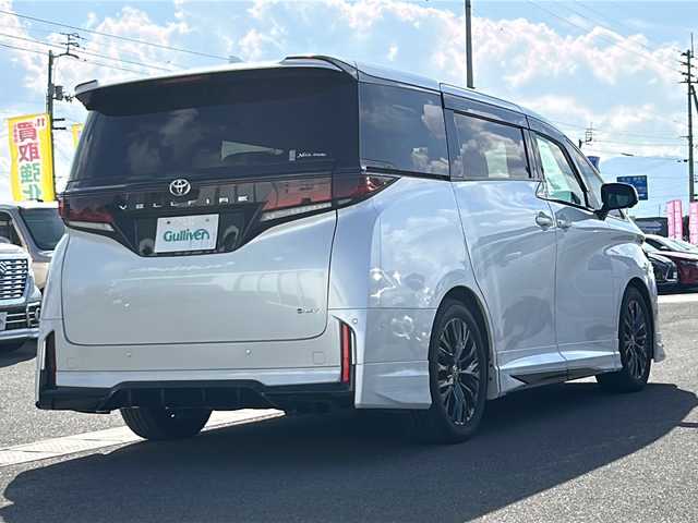 トヨタ ヴェルファイア ハイブリット Z プレミア 香川県 2023(令5)年 6.7万km プラチナホワイトパールマイカ 純正14インチHDディスプレイオーディオPlus（フルセグTV/BT)/アラウンドユーモニター/ブラインドスポットモニター/デジタルインナーミラー/後席モニター/ドライバーモニター/純正GRエアロ（フロント，サイド，リア）/両側パワースライドドア/サンルーフ/3列シート/電動リアゲート/ドライブレコーダー/パワーシート/シートヒーター/エアシート/コーナーセンサー/オートマチックハイビーム/シートメモリー/社外マフラー/ビルトインETC2.0