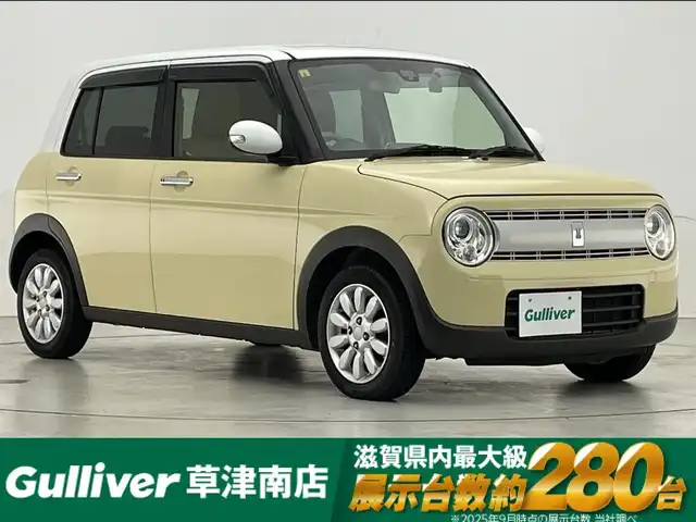 スズキ ラパン X 滋賀県 2016(平28)年 5.1万km シフォンアイボリーメタリック 社外9インチナビ/【Bluetooth/CD/DVD/フルセグTV】/バックカメラ/衝突軽減ブレーキ/HIDヘッドライト/オートライト/前後ドライブレコーダー/D席シートヒーター/ビルトインETC/ドアバイザー/純正フロアマット/プッシュスタート/スマートキー