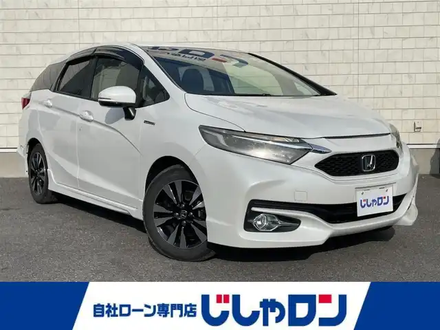 ホンダ シャトル ハイブリッド X 栃木県 2015(平27)年 9.8万km ホワイトオーキッドパール 株)IDOMが運営する【じしゃロン小山店】の自社ローン専用車両になります。こちらは現金またはオートローンご利用時の価格です。自社ローンご希望の方は別途その旨お申付け下さい//禁煙車/純正ワンセグナビ/（CD/DVD/AM/FMラジオ）/(Bluetooth)/スマートキー/プッシュスタート/バックカメラ/シティブレーキアクティブシステム/クルーズコントロール/ステアリングリモコン/電動格納ドアミラー/パワーウインドウ/防眩ミラー/オートライト