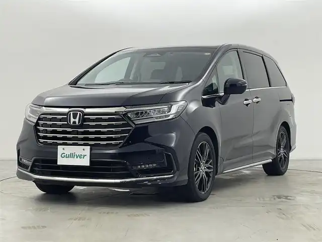 ホンダ オデッセイ ハイブリッド e:HEVアブソルート EX 群馬県 2024(令6)年 2.4万km プレミアムヴィーナスブラックP 純正フリップダウンモニター/純正11.4インチナビ/・AM/FM/CD/DVD/HDMI/iPod/フルセグTV/・AppleCarPlay/AndroidAuto/Bluetooth/マルチビューカメラシステム/ホンダセンシング/・衝突軽減ブレーキ（CMBS）/・先行車発進お知らせ機能/・歩行者事故低減ステアリング/・路外逸脱抑制機能/・標識認識機能/・渋滞追従機能付アダプティブクルーズコントロール（ACC）/・車線維持支援システム（LKAS）/・ブラインドスポットインフォメーション/・オートハイビーム/・誤発進抑制機能/・後方誤発進抑制機能/・近距離衝突軽減ブレーキ/・急アクセル抑制機能/・パーキングセンサーシステム/・後退出庫サポート/Honda CONNECT for Gathers+ナビ装着用スペシャルパッケージ/2列目両側アームレスト付４ウェイパワーシート/2列目使途センターテーブル/運転席・助手席パワーシート/運転席・助手席シートヒーター+２列目シートヒーター/ハンズフリーアクセスパワーテールゲート/本革シート/センターコンソールボックス+ワイヤレスチャージャー/ETC2.0/純正前後ドライブレコーダー【DRH-224SD】