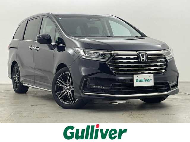ホンダ オデッセイ ハイブリッド e:HEVアブソルート EX 群馬県 2024(令6)年 2.4万km プレミアムヴィーナスブラックP 純正フリップダウンモニター/純正11.4インチナビ/・AM/FM/CD/DVD/HDMI/iPod/フルセグTV/・AppleCarPlay/AndroidAuto/Bluetooth/マルチビューカメラシステム/ホンダセンシング/・衝突軽減ブレーキ（CMBS）/・先行車発進お知らせ機能/・歩行者事故低減ステアリング/・路外逸脱抑制機能/・標識認識機能/・渋滞追従機能付アダプティブクルーズコントロール（ACC）/・車線維持支援システム（LKAS）/・ブラインドスポットインフォメーション/・オートハイビーム/・誤発進抑制機能/・後方誤発進抑制機能/・近距離衝突軽減ブレーキ/・急アクセル抑制機能/・パーキングセンサーシステム/・後退出庫サポート/Honda CONNECT for Gathers+ナビ装着用スペシャルパッケージ/2列目両側アームレスト付４ウェイパワーシート/2列目使途センターテーブル/運転席・助手席パワーシート/運転席・助手席シートヒーター+２列目シートヒーター/ハンズフリーアクセスパワーテールゲート/本革シート/センターコンソールボックス+ワイヤレスチャージャー/ETC2.0/純正前後ドライブレコーダー【DRH-224SD】