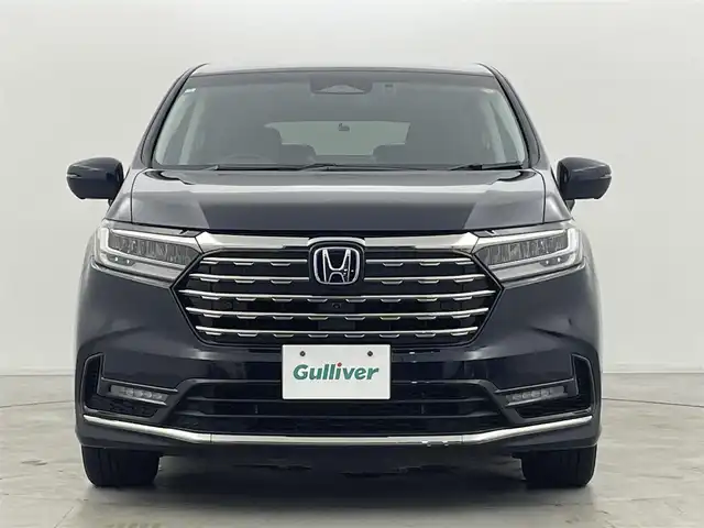 ホンダ オデッセイ ハイブリッド e:HEVアブソルート EX 群馬県 2024(令6)年 2.4万km プレミアムヴィーナスブラックP 純正フリップダウンモニター/純正11.4インチナビ/・AM/FM/CD/DVD/HDMI/iPod/フルセグTV/・AppleCarPlay/AndroidAuto/Bluetooth/マルチビューカメラシステム/ホンダセンシング/・衝突軽減ブレーキ（CMBS）/・先行車発進お知らせ機能/・歩行者事故低減ステアリング/・路外逸脱抑制機能/・標識認識機能/・渋滞追従機能付アダプティブクルーズコントロール（ACC）/・車線維持支援システム（LKAS）/・ブラインドスポットインフォメーション/・オートハイビーム/・誤発進抑制機能/・後方誤発進抑制機能/・近距離衝突軽減ブレーキ/・急アクセル抑制機能/・パーキングセンサーシステム/・後退出庫サポート/Honda CONNECT for Gathers+ナビ装着用スペシャルパッケージ/2列目両側アームレスト付４ウェイパワーシート/2列目使途センターテーブル/運転席・助手席パワーシート/運転席・助手席シートヒーター+２列目シートヒーター/ハンズフリーアクセスパワーテールゲート/本革シート/センターコンソールボックス+ワイヤレスチャージャー/ETC2.0/純正前後ドライブレコーダー【DRH-224SD】