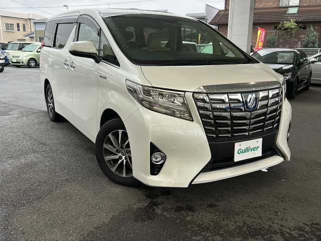 トヨタ アルファードハイブリット エグゼクティブ ラウンジ 埼玉県 2015(平27)年 11.9万km ホワイトパールクリスタルシャイン 運転席エアバッグ	/助手席エアバッグ	/サイドエアバッグ	/ABS(アンチロックブレーキ)	/トラクションコントロール	/前席シートベルトプリテンショナー	/前席シートベルトフォースリミッター	/後席３点式シートベルト	/サイドインパクトバー	/ブレーキアシスト	/衝突安全ボディー	採用/EBD（電子制動力配分装置）	/盗難防止システム	/その他安全装備	VSC/ナビゲーション	/ナビゲーションメディア	メモリータイプ/サウンド（カセット&MD）	AM/FMラジオ/CDプレイヤー/エアコン	デュアルエアコン/パワーウィンドウ	/集中ドアロック		/クルーズコントロール	/革シート/運転席パワーシート	/ウッドパネル	/サンルーフ/アルミホイール	17インチ標準/UVカットガラス	/プライバシーガラス/ETC/パワーバックドア/オットマン/両側パワースライドドア/クルーズコントロール/フルセグテレビ/プッシュスタート/バックカメラ/フリップダウンモニター