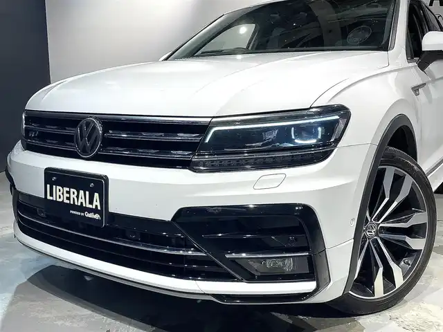 フォルクスワーゲン ティグアン TDI 4モーション Rライン 道央・札幌 2018(平30)年 6.6万km ピュアホワイト スマート＆エントリーシステム/カミングホーム＆リービングホーム/インテリアアンビエントライト/シートバックテーブル/Volkswagen純正インフォテイメントシステム/モバイルオンラインサービス/チルト＆テレスコピックステアリング/電動パワーステアリング/パワーシート（D/N）/シートヒーター（D/ N）/レザーシフトノブ/電動格納式サイドミラー/アレルゲン除去機能付きフレッシュエアフィルター/エレクトロニックパーキングブレーキ/分離可倒式シート/パワーテールゲート/ビルトインETC