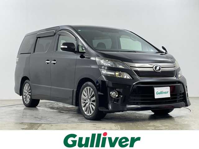 トヨタ ヴェルファイア 2．4Z ゴールデンアイズ 道央・札幌 2012(平24)年 9.9万km ブラック ・４WD　/寒冷地仕様/・純正HDDディーラーOPナビ/・DVD.CD.HDD.Bluetooth/・フルセグ.SD.バックカメラ/・純正フリップダウンモニター/・2列目オットマンシート/・両側パワースライドドア/・パワースライドドア/・HIDライト/オートライト/・ウッドコンビハンドル/・ハーフレザーシート/・スマートキー/・スタッドレスタイヤ積込み