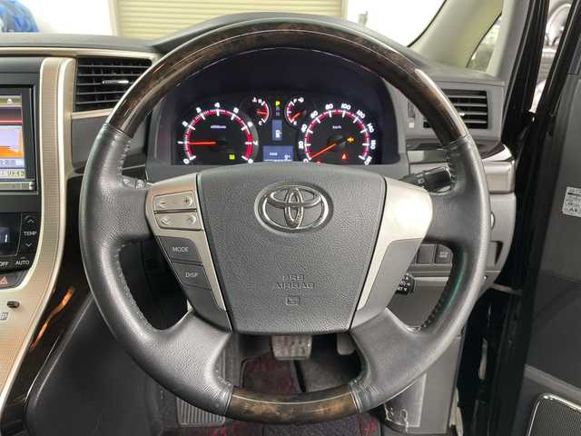 トヨタ ヴェルファイア 2．4Z ゴールデンアイズ 道央・札幌 2012(平24)年 9.9万km ブラック ・４WD　/寒冷地仕様/・純正HDDディーラーOPナビ/・DVD.CD.HDD.Bluetooth/・フルセグ.SD.バックカメラ/・純正フリップダウンモニター/・2列目オットマンシート/・両側パワースライドドア/・パワースライドドア/・HIDライト/オートライト/・ウッドコンビハンドル/・ハーフレザーシート/・スマートキー/・スタッドレスタイヤ積込み