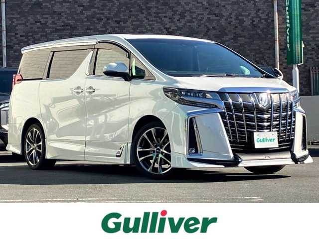 トヨタ アルファード S Cパッケージ 静岡県 2020(令2)年 5.7万km ホワイトパールクリスタルシャイン 純正10.5インチナビ（BT/フルセグ）/バックカメラ/TRDフルエアロ/電動リアゲート/エンジンスタートボタン/パワーステアリング/パワーウィンドウ/取扱説明書/１００V充電/スマートキー/スペアキー1本/Wオートエアコン/レーダークルーズコントロール/純正ビルドインETC2.0/ツインサンルーフ/N席電動オットマン/二列目電動オットマン/二列目電動リクライニング/合皮シート/D席N席シートヒーター/D席N席エアシート/D席N席パワーシート/純正ドライブレコーダー/ウォークスルー/電動リアゲート/純正フロアマット/純正エントランスマット/両側パワースライドドア/TRD１９インチアルミホイール/ABS/横滑り防止装置/コーナーセンサー前後/レーンキープアシスト/オートライト/オートマチックハイビーム/三眼LED/W+サイドエアバッグ/カーテンエアバッグ/衝突軽減システム/ステアリングヒーター/純正プロテクションフィルム（ドアハンドル/リアバンパー）
