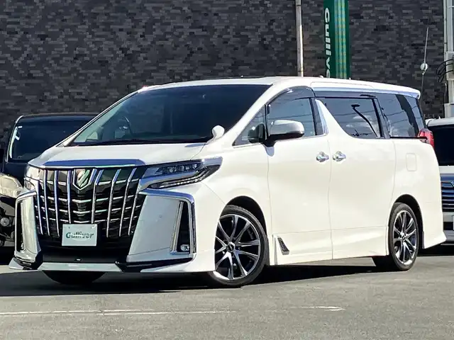 トヨタ アルファード S Cパッケージ 静岡県 2020(令2)年 5.7万km ホワイトパールクリスタルシャイン 純正10.5インチナビ（BT/フルセグ）/バックカメラ/TRDフルエアロ/電動リアゲート/エンジンスタートボタン/パワーステアリング/パワーウィンドウ/取扱説明書/１００V充電/スマートキー/スペアキー1本/Wオートエアコン/レーダークルーズコントロール/純正ビルドインETC2.0/ツインサンルーフ/N席電動オットマン/二列目電動オットマン/二列目電動リクライニング/合皮シート/D席N席シートヒーター/D席N席エアシート/D席N席パワーシート/純正ドライブレコーダー/ウォークスルー/電動リアゲート/純正フロアマット/純正エントランスマット/両側パワースライドドア/TRD１９インチアルミホイール/ABS/横滑り防止装置/コーナーセンサー前後/レーンキープアシスト/オートライト/オートマチックハイビーム/三眼LED/W+サイドエアバッグ/カーテンエアバッグ/衝突軽減システム/ステアリングヒーター/純正プロテクションフィルム（ドアハンドル/リアバンパー）