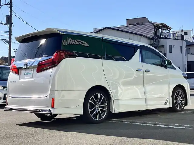 トヨタ アルファード S Cパッケージ 静岡県 2020(令2)年 5.7万km ホワイトパールクリスタルシャイン 純正10.5インチナビ（BT/フルセグ）/バックカメラ/TRDフルエアロ/電動リアゲート/エンジンスタートボタン/パワーステアリング/パワーウィンドウ/取扱説明書/１００V充電/スマートキー/スペアキー1本/Wオートエアコン/レーダークルーズコントロール/純正ビルドインETC2.0/ツインサンルーフ/N席電動オットマン/二列目電動オットマン/二列目電動リクライニング/合皮シート/D席N席シートヒーター/D席N席エアシート/D席N席パワーシート/純正ドライブレコーダー/ウォークスルー/電動リアゲート/純正フロアマット/純正エントランスマット/両側パワースライドドア/TRD１９インチアルミホイール/ABS/横滑り防止装置/コーナーセンサー前後/レーンキープアシスト/オートライト/オートマチックハイビーム/三眼LED/W+サイドエアバッグ/カーテンエアバッグ/衝突軽減システム/ステアリングヒーター/純正プロテクションフィルム（ドアハンドル/リアバンパー）