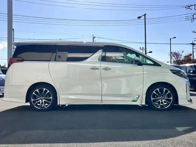 トヨタ アルファード S Cパッケージ 静岡県 2020(令2)年 5.7万km ホワイトパールクリスタルシャイン 純正10.5インチナビ（BT/フルセグ）/バックカメラ/TRDフルエアロ/電動リアゲート/エンジンスタートボタン/パワーステアリング/パワーウィンドウ/取扱説明書/１００V充電/スマートキー/スペアキー1本/Wオートエアコン/レーダークルーズコントロール/純正ビルドインETC2.0/ツインサンルーフ/N席電動オットマン/二列目電動オットマン/二列目電動リクライニング/合皮シート/D席N席シートヒーター/D席N席エアシート/D席N席パワーシート/純正ドライブレコーダー/ウォークスルー/電動リアゲート/純正フロアマット/純正エントランスマット/両側パワースライドドア/TRD１９インチアルミホイール/ABS/横滑り防止装置/コーナーセンサー前後/レーンキープアシスト/オートライト/オートマチックハイビーム/三眼LED/W+サイドエアバッグ/カーテンエアバッグ/衝突軽減システム/ステアリングヒーター/純正プロテクションフィルム（ドアハンドル/リアバンパー）