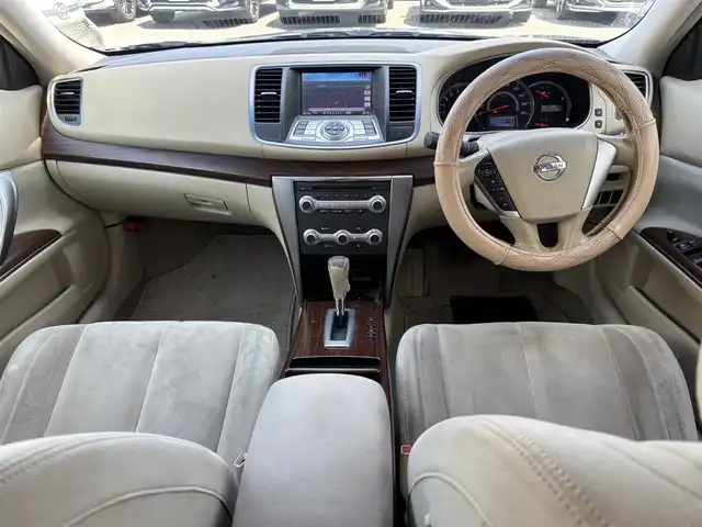 日産 ティアナ 250XL 東京都 2012(平24)年 9.9万km ディープアメジストグレー VDC/TCS/メッキ加飾横３本バーフロントグリル/開口部無塗装１本桟フロントバンパー/ボディ同色電動格納ミラー/ウィンカーミラー/リア標準バンパー/木目調加飾シルキーエクリュインパネ/ファインビジョンメーター（自発光式アナログメーター）/シルキーエクリュ革巻きステアリングホイール/SRSエアバック （運転席/助手席/サイド）/左右独立温度調整オートエアコン/後席エアコン吹出口/シルキーエクリュシート/パワーシート（運転席/助手席）パワーオットマン （助手席）/シート別体上下調整式ヘッドレスト（後席左右中央）/木目調カップホルダー付きアームレスト（後席中央）/インテリジェントキー/イモビライザー/プッシュエンジンスターター/７インチ液晶モニター/スーパーサウンドシステム１（６CD/６スピーカー）/バックモニター
