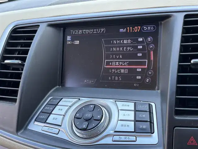 日産 ティアナ 250XL 東京都 2012(平24)年 9.9万km ディープアメジストグレー VDC/TCS/メッキ加飾横３本バーフロントグリル/開口部無塗装１本桟フロントバンパー/ボディ同色電動格納ミラー/ウィンカーミラー/リア標準バンパー/木目調加飾シルキーエクリュインパネ/ファインビジョンメーター（自発光式アナログメーター）/シルキーエクリュ革巻きステアリングホイール/SRSエアバック （運転席/助手席/サイド）/左右独立温度調整オートエアコン/後席エアコン吹出口/シルキーエクリュシート/パワーシート（運転席/助手席）パワーオットマン （助手席）/シート別体上下調整式ヘッドレスト（後席左右中央）/木目調カップホルダー付きアームレスト（後席中央）/インテリジェントキー/イモビライザー/プッシュエンジンスターター/７インチ液晶モニター/スーパーサウンドシステム１（６CD/６スピーカー）/バックモニター
