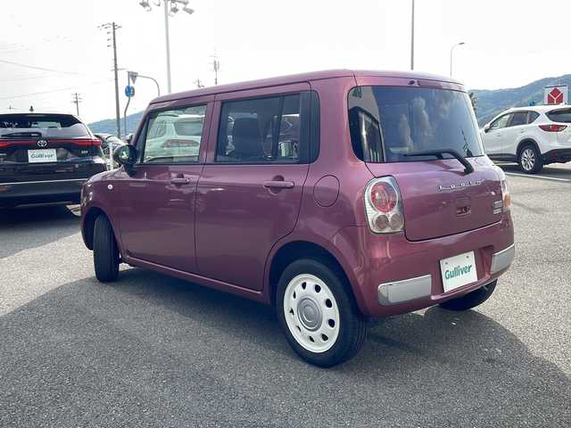 スズキ ラパン ショコラ G 兵庫県 2014(平26)年 4.4万km カシスピンクパールメタリック 社外SDナビ/・BT/・CD/DVD/・USB/・フルセグ/衝突軽減/オートライト/ビルトインETC/純正フロアマット/革調シート/アイドリングストップ/LEDライト