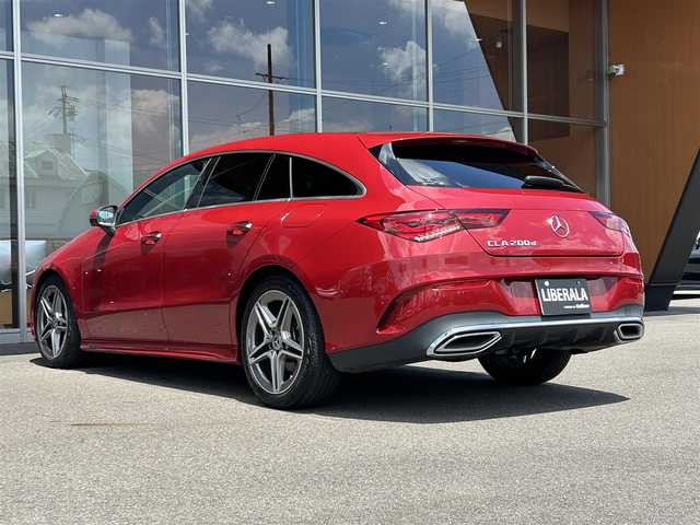 メルセデス・ベンツ Ｍ・ベンツ ＣＬＡ２００ｄ Sブレーク AMGライン 岐阜県 2023(令5)年 1.8万km 赤 パノラミックスライディングルーフ/レーダーセーフティパッケージ/　アクティブブラインドスポットアシスト/　アクティブディスタンスアシストディストロニック/　アクティブステアリングアシスト/　PRE-SAFE/　自動再発進機能/AMGラインパッケージ/　アダプティブハイビームアシスト/　マルチビームLEDヘッドライト/　AMGラインスタイリング/　スポーツブレーキシステム/　ローワードコンフォートサスペンション/　スポーツシート/　本革巻スポーツステアリング/アドバンスドパッケージ/　360°カメラ/　ブランドロゴプロジェクターライト/　ヘッドアップディスプレイ/　MBUXインテリアアシスタント/デジタルコックピットディスプレイ/純正ナビゲーション/フルセグTV/Bluetooth