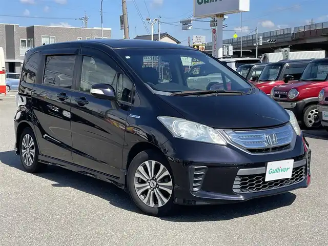 ホンダ フリード ハイブリット ジャストセレクション 石川県 2012(平24)年 8.8万km プレミアムブラキッシュパール 純正9型ナビ/フルセグTV/バックカメラ/HIDヘッドライト/ETC/両側パワースライドドア/スマートキー/電動ミラー/ハーフレザーシート/オートエアコン/オートライト