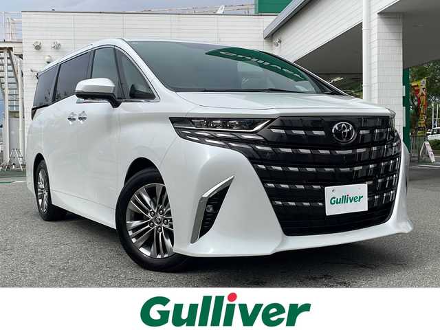 トヨタ アルファード Z 兵庫県 2025(令7)年 0.1万km プラチナホワイトパールマイカ ワンオーナー/保証書・記録簿・取説・有/純正メモリーナビ・フルセグ・BT・FM・AM・HDMI・USB/ETC2.0/バックカメラ/全周囲カメラ/追尾機能付きクルーズコントロール/車線逸脱防止支援システム/衝突被害軽減ブレーキ/クリアランスソナー/パーキングブレーキサポート/ブラインドスポットミラー/ロードサインアシスト/両側パワースライドドア/パワーバックドア/運転席/助手席/セカンドシート/シートクーラー・シートヒーター/ブレーキホールド/電動パーキングブレーキ/ワイヤレス充電器/プッシュスタート/スマートキー×1