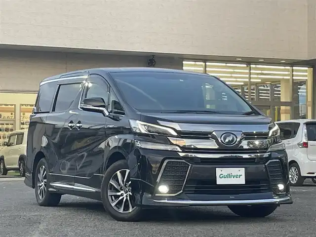 トヨタ ヴェルファイア ハイブリット ZR Gエディション 宮城県 2017(平29)年 5.6万km ブラック モデリスタエアロ（F、S、R）/レーダークルーズコントロール/コーナーセンサー/アルパイン後席フリップダウン式モニター/アルパインパワーサブウーハー/アルパインナビ（フルセグTV、SD、DVD、CD、BT）/アルパインカーアロマ/３列シート/レザーシート/パワーシート/（運転席、助手席、2列目後席シート）/ケンウッドETC２．０/コムテックテレビユーティリティー/オートライト/ドアバイザー/AC１００V/ステアリングヒーター/パーキングホールド/両側パワースライドドア/パワーバックドア/社外アルミ夏タイヤ/(235/50R18)/PWRドア切り替え/ECOモード/横滑り防止/純正スタートスターター×１/純正ステップライト/スマートキー×２/シートポジションスイッチ(運転席)