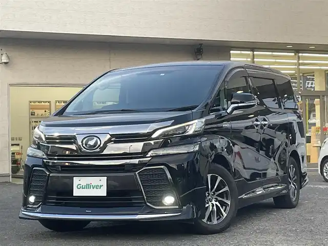 トヨタ ヴェルファイア ハイブリット ZR Gエディション 宮城県 2017(平29)年 5.6万km ブラック モデリスタエアロ（F、S、R）/レーダークルーズコントロール/コーナーセンサー/アルパイン後席フリップダウン式モニター/アルパインパワーサブウーハー/アルパインナビ（フルセグTV、SD、DVD、CD、BT）/アルパインカーアロマ/３列シート/レザーシート/パワーシート/（運転席、助手席、2列目後席シート）/ケンウッドETC２．０/コムテックテレビユーティリティー/オートライト/ドアバイザー/AC１００V/ステアリングヒーター/パーキングホールド/両側パワースライドドア/パワーバックドア/社外アルミ夏タイヤ/(235/50R18)/PWRドア切り替え/ECOモード/横滑り防止/純正スタートスターター×１/純正ステップライト/スマートキー×２/シートポジションスイッチ(運転席)