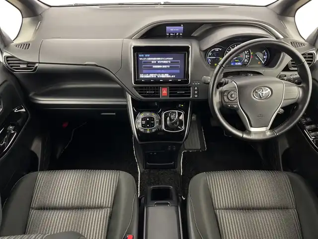 トヨタ ヴォクシー ハイブリッド ZS 煌 鹿児島県 2018(平30)年 5.7万km ホワイトパールクリスタルシャイン Toyota Safety Sense/・プリクラッシュセーフティ/・レーンディパーチャーアラート/・オートハイビーム/クルーズコントロール/両側パワースライドドア/純正9型ナビ/（フルセグV/DVD/CD/Bluetooth）/バックカメラ/革巻きステアリング/ステアリングスイッチ/前席シートヒーター/ETC/LEDヘッドライト/ウインカーミラー/純正16インチアルミホイル/スマートキー/保証書/取扱説明書