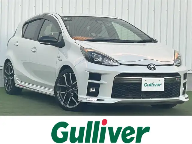 トヨタ アクア G GRスポーツ 17インチPKG 香川県 2019(令1)年 6.7万km ホワイトパールクリスタルシャイン 純正9型SDナビ【NSZT-Y68T】/（フルセグTV/Bluetooth/DVD/MSV）/バックカメラ/前後ドライブレコーダー【ZDR-015】/プリクラッシュセーフティ/レーンディパーチャーアラート/オートマチックハイビーム/先行車発進アラート/ハーフレザーシート/革巻きステアリング/ステアリングスイッチ/オートライト/LEDヘッドライト/LEDフォグライト/純正ビルトインETC/純正17インチアルミホイール/純正フロアマット/センターコンソール/ドアバイザー/ウィンカー付電動格納ミラー/ISOFIX