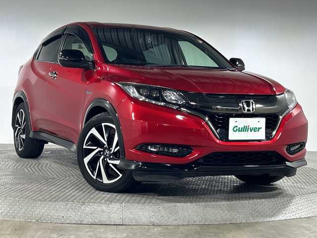 ホンダ ヴェゼル ハイブリッド RS ホンダセンシング 神奈川県 2016(平28)年 5.1万km プレミアムクリスタルレッドM ホンダセンシング/社外8型フローティングナビ【MDV-S810F】/・BT/フルセグTV/CD/DVD/USB/HDMI/SD/バックカメラ/ハーフレザーシート/シートヒーター(D/N)/電動サイドブレーキ/ブレーキホールド/スポーツモード/ビルトインETC/前後ドライブレコーダー/革巻きステアリング/ステアリングスイッチ/パドルシフト/Autoライト/ECON/フロントデアイサー/自動防眩ミラー/スマートキー/プッシュスタートボタン/LEDヘッドライト/フォグランプ/シートリフター/電動格納ミラー/ウィンカーミラー/純正フロアマット/純正18インチアルミホイール/純正ドアバイザー