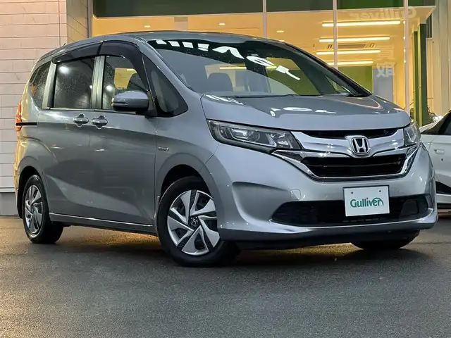 ホンダ フリード ハイブリット G ホンダセンシング 兵庫県 2016(平28)年 7.8万km ルナシルバーM hosi純正メモリナビ/両側パワースライドドア/バックカメラ/追従有クルーズコントロール/オートライト/フルセグTV/Bluetooth接続/ETC/LEDヘッドライト/純正ドアバイザー/純正フロアマット/CD/DVD/純正ミュージックサーバー/スイッチスタート