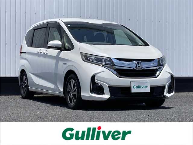 ホンダ フリード ハイブリット EX 千葉県 2017(平29)年 8.8万km ホワイトオーキッドパール 純正9インチナビ/(CD/DVD/BT/フルセグTV)/バックカメラ/衝突被害軽減システム/車線逸脱警報/クルーズコントロール/ハーフレザーシート/両側パワースライドドア/横滑り防止装置/ETC/アイドリングストップ/LEDヘッドライト/フォグランプ/オートライト/ウィンカーミラー/電動格納ミラー/純正15インチAW/シートヒーター/プッシュスタート/スマートキー/フロアマット/ドアバイザー/スペアキー/取扱説明書/保証書