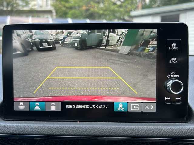 ホンダ シビック e:HEV 大阪府 2023(令5)年 3.1万km プレミアムクリスタルレッドM ワンオーナー/純正メモリナビ/・FM/AM/Bluetooth/・フルセグテレビ/ETC2.0/前後ドライブレコーダー/バックカメラ/ワイヤレス充電器/衝突軽減ブレーキ/レーンキープアシスト/革巻きステアリング/ステアリングリモコン/パドルシフト/シートヒーター（D席+N席）/コーナーセンサー/LEDヘッドライト/オートライト/オートエアコン/スマートキー×2/プッシュスタートボタン/12V電源/USBジャック/純正18インチアルミホイール/純正フロアマット/取扱説明書/保証書