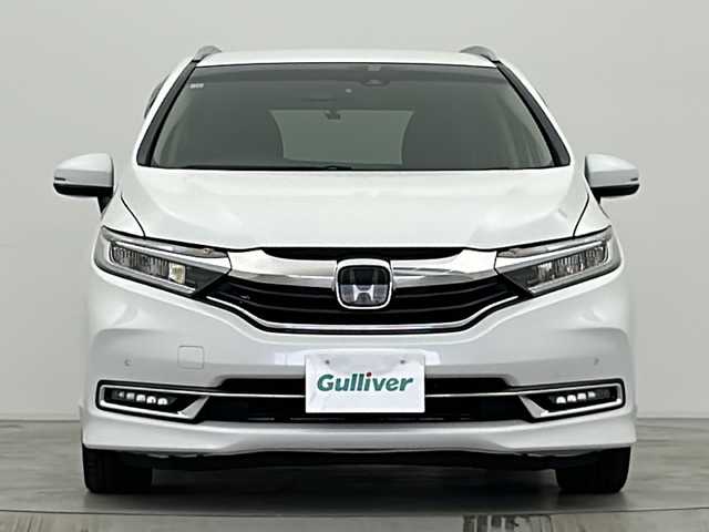 ホンダ シャトル ハイブリッド Z ホンダセンシング 宮城県 2020(令2)年 3.1万km プラチナホワイトパール 純正ナビ/・BT接続/iPod接続/MT付AT/パドルシフト/純正装備品/・16インチAW/・フロアマット/・LEDヘッドライト/ホンダセンシング/・衝突軽減ブレーキ/・歩行者事故低減ステアリング/・アダプティブクルーズコントロール/・路外逸脱抑制機能/バックカメラ/ビルトインETC/革巻きステアリング