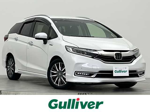 ホンダ シャトル ハイブリッド Z ホンダセンシング 宮城県 2020(令2)年 3.1万km プラチナホワイトパール 純正ナビ/・BT接続/iPod接続/MT付AT/パドルシフト/純正装備品/・16インチAW/・フロアマット/・LEDヘッドライト/ホンダセンシング/・衝突軽減ブレーキ/・歩行者事故低減ステアリング/・アダプティブクルーズコントロール/・路外逸脱抑制機能/バックカメラ/ビルトインETC/革巻きステアリング