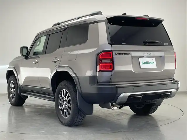 トヨタ ランドクルーザー ２５０ VX 愛知県 2024(令6)年 2.9万km アバンギャルドブロンズメタリック 純正１２．３インチディスプレイオーディオ/トヨタチームメイト　/丸目ヘッドライト　/モデリスタＰＫＧ　/シグネチャーイルミブレード　/モデリスタオーバーフェンダー　/リアバンパーステップガード/トヨタセーフティセンス/デジタルインナーミラー/アラウンドビューモニター/ムーンルーフ/ブラインドスポットモニター/HDMI/ステアリングヒーター/レーダークルーズコントロール/黒革シート/パワーシート/パワーバックドア/シートヒーター/エアシート/フルセグTV/前後ドライブレコーダー/ETC2.0/純正アルミホイール/純正フロアマット/LEDオートライト/フォグランプ/Miracast/衝突被害軽減ブレーキ