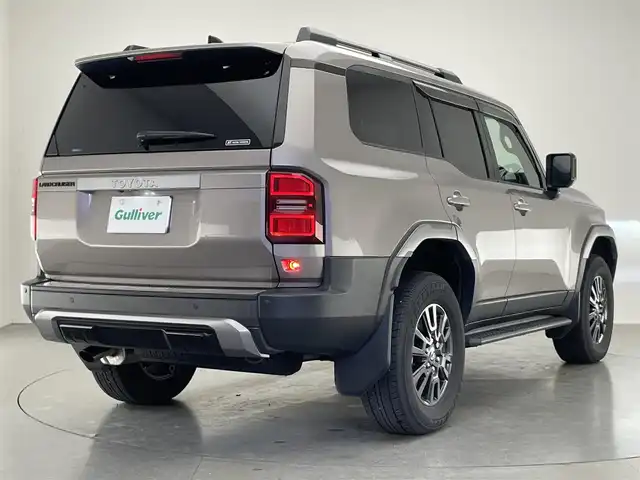トヨタ ランドクルーザー ２５０ VX 愛知県 2024(令6)年 2.9万km アバンギャルドブロンズメタリック 純正１２．３インチディスプレイオーディオ/トヨタチームメイト　/丸目ヘッドライト　/モデリスタＰＫＧ　/シグネチャーイルミブレード　/モデリスタオーバーフェンダー　/リアバンパーステップガード/トヨタセーフティセンス/デジタルインナーミラー/アラウンドビューモニター/ムーンルーフ/ブラインドスポットモニター/HDMI/ステアリングヒーター/レーダークルーズコントロール/黒革シート/パワーシート/パワーバックドア/シートヒーター/エアシート/フルセグTV/前後ドライブレコーダー/ETC2.0/純正アルミホイール/純正フロアマット/LEDオートライト/フォグランプ/Miracast/衝突被害軽減ブレーキ
