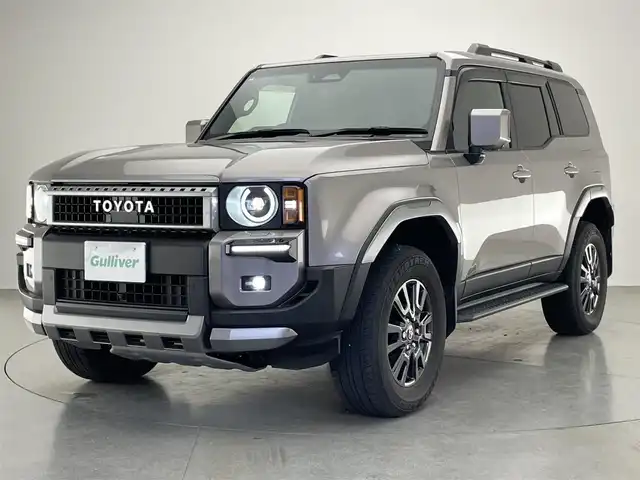 トヨタ ランドクルーザー ２５０ VX 愛知県 2024(令6)年 2.9万km アバンギャルドブロンズメタリック 純正１２．３インチディスプレイオーディオ/トヨタチームメイト　/丸目ヘッドライト　/モデリスタＰＫＧ　/シグネチャーイルミブレード　/モデリスタオーバーフェンダー　/リアバンパーステップガード/トヨタセーフティセンス/デジタルインナーミラー/アラウンドビューモニター/ムーンルーフ/ブラインドスポットモニター/HDMI/ステアリングヒーター/レーダークルーズコントロール/黒革シート/パワーシート/パワーバックドア/シートヒーター/エアシート/フルセグTV/前後ドライブレコーダー/ETC2.0/純正アルミホイール/純正フロアマット/LEDオートライト/フォグランプ/Miracast/衝突被害軽減ブレーキ