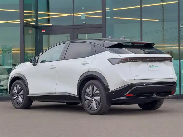 日産 アリア B9 e－4ORCE 東京都 2024(令6)年 0.6万km パールⅡ パノラミックガラスルーフ/（電動チルト＆スライド、電動格納シェード付、リモート機能付)/BOSEプレミアムサウンドシステム＆10スピーカー/ヘッドアップディスプレイ/EV専用Nissan Connect　ナビゲーションシステム/・12.3インチワイドディスプレイ/・USB/HDMI/Bluetooth/フルセグTV/・Apple Car Play/Android Auto/・Amazon Alexa　搭載/アラウンドビューモニター/プロパイロット2.0/ETC2.0/インテリジェントルームミラー/電動センターコンソール/ハーフレザーシート/パワーシート/シートヒーター/ステアリングヒーター/置くだけ充電/電動リアゲート/BSM