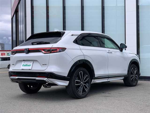 ホンダ ヴェゼル ハイブリッド e:HEV Z 大阪府 2021(令3)年 0.7万km プラチナホワイトパール 純正9インチナビ/   フルセグTV/Bluetooth/USB/衝突軽減/BSM/全方位モニター/シートヒーター/フルエアロ/レーダークルーズコントロール/電動リアゲート/前後ドライブレコーダー/純正フロアマット/ワイヤレス充電/ETC2.0/LEDヘッドライト