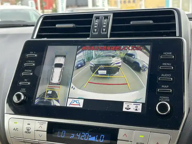 トヨタ ランドクルーザー プラド TX Lパッケージ 愛媛県 2023(令5)年 2.1万km ホワイトパールクリスタルシャイン 登録時走行距離：20800km/メーカーオプション純正メモリナビ/AM/FM/フルセグTV/Bluetooth/ETC/電動サードシート/パドルシフト/追従クルコン/レザーシート/シートヒーター/エアシート/衝突軽減システム/横滑り防止装置/盗難防止装置/レーンキープアシスト/LEDヘッドライト/オートライト/オートハイビーム/エンジンスタートボタン/スマートキー/スペアキー/純正アルミホイール/社外フロアマット