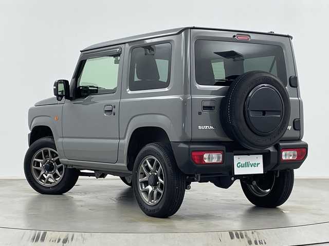 スズキ ジムニー XC 埼玉県 2023(令5)年 2.6万km ミディアムグレー 純正ナビ　CN-HE02WD/(Bluetooth/CD/DVD/USB/AM/FM)/地デジワンセグ/バックカメラ/前後ドライブレコーダー/クルーズコントロール/衝突軽減ブレーキ/車線逸脱警報/ダウンヒルアシストコントロール/4WD/アイドリングストップ/ヘッドライトウォッシャー/運転席・助手席シートヒーター/フロントフォグランプ/ウィンカーミラー/純正フロアマット/純正ドアバイザー/純正16インチアルミホイール