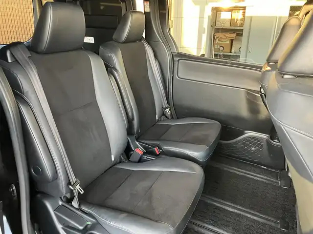 トヨタ ノア ハイブリッド Si ダブルバイビーⅡ 広島県 2019(平31)年 4.9万km ブラック ディーラーオプションナビ（NSZN-Z68T）/バックカメラ/フルセグTV/Bluetooth/純正フリップダウンモニター（V12T-R68C）/両側パワースライドドア/セーフティセンス/クルーズコントロール/LEDヘッドライト/LEDフォグライト/オートライト/シートヒーター（運転席・助手席）/新車保証書/取扱説明書/スペアキー