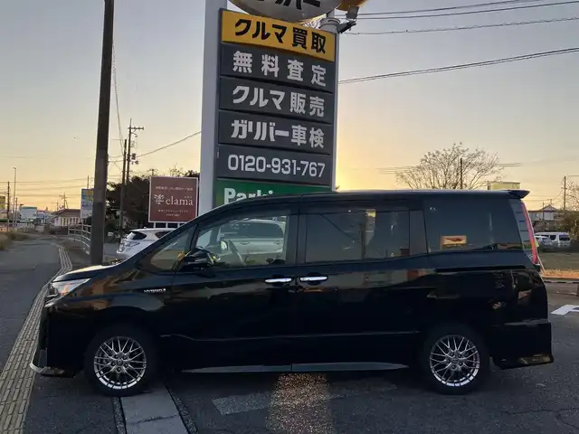 トヨタ ノア ハイブリッド Si ダブルバイビーⅡ 広島県 2019(平31)年 4.9万km ブラック ディーラーオプションナビ（NSZN-Z68T）/バックカメラ/フルセグTV/Bluetooth/純正フリップダウンモニター（V12T-R68C）/両側パワースライドドア/セーフティセンス/クルーズコントロール/LEDヘッドライト/LEDフォグライト/オートライト/シートヒーター（運転席・助手席）/新車保証書/取扱説明書/スペアキー