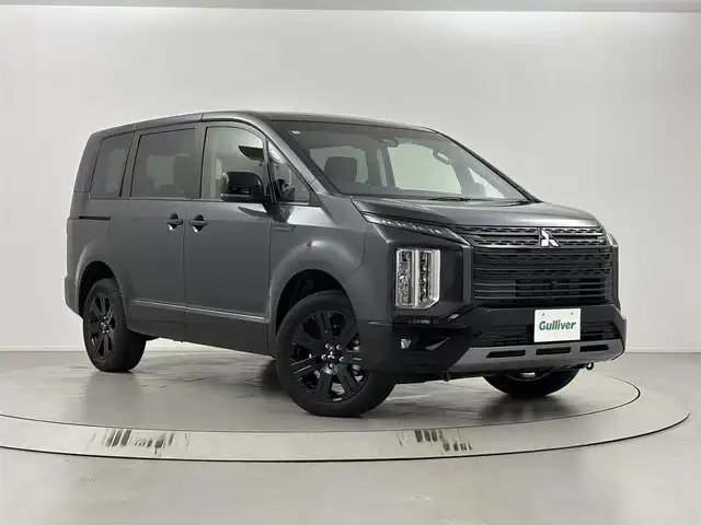 三菱 デリカＤ：５ シャモニー 埼玉県 2025(令7)年 0.1万km未満 紺Ⅱ CHAMONIX (7人)　4WD　e-Assist/オリジナルナビ取付パッケージ＋リアモニター取パッケージ(25300)/ステップレス　（7人）/ステアリングヒーター/シートヒーター/パドルシフト/ステアリングリモコン/レーダークルーズコントロール/BMS/電動格納ウィンカーミラー/両側パワースライドドア/純正１８インチアルミホイール/純正LEDヘッドライト