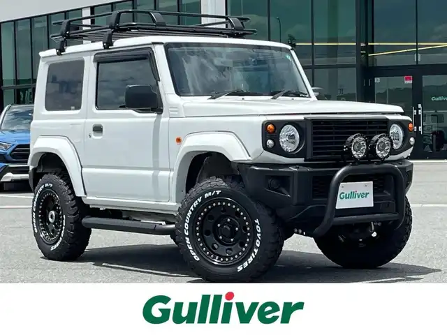 スズキ ジムニー XG 奈良県 2020(令2)年 4.4万km スペリアホワイト 4WD/社外ナビ(ワンセグTV/CD/DVD/AM・FM/BT)/前方ドラレコ/GIGEAR3インチリフトアップKIT(body lift)/GIGEARオーバーフェンダー/GIGEARブラックレザーシートカバー/グリルガードブルバー/リアラダー/オフロードルーフラック/ディフェンダーグリル/3インチサイドステップ/背面タイヤハードカバー/LEDヘッドライト/LEDフォグランプ/METAL　ROCK16インチビートリングホイール/社外フロアマット/リモコンキー