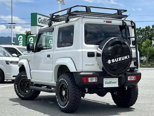 スズキ ジムニー XG 奈良県 2020(令2)年 4.4万km スペリアホワイト 4WD/社外ナビ(ワンセグTV/CD/DVD/AM・FM/BT)/前方ドラレコ/GIGEAR3インチリフトアップKIT(body lift)/GIGEARオーバーフェンダー/GIGEARブラックレザーシートカバー/グリルガードブルバー/リアラダー/オフロードルーフラック/ディフェンダーグリル/3インチサイドステップ/背面タイヤハードカバー/LEDヘッドライト/LEDフォグランプ/METAL　ROCK16インチビートリングホイール/社外フロアマット/リモコンキー