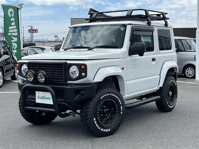 スズキ ジムニー XG 奈良県 2020(令2)年 4.4万km スペリアホワイト 4WD/社外ナビ(ワンセグTV/CD/DVD/AM・FM/BT)/前方ドラレコ/GIGEAR3インチリフトアップKIT(body lift)/GIGEARオーバーフェンダー/GIGEARブラックレザーシートカバー/グリルガードブルバー/リアラダー/オフロードルーフラック/ディフェンダーグリル/3インチサイドステップ/背面タイヤハードカバー/LEDヘッドライト/LEDフォグランプ/METAL　ROCK16インチビートリングホイール/社外フロアマット/リモコンキー