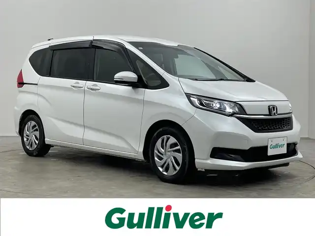 ホンダ フリード G 埼玉県 2023(令5)年 2万km プラチナホワイトパール 純正９インチナビ　フリップダウンモニター　バックカメラ　ビルトインＥＴＣ　ドライブレコーダー　アダクティブクルーズコントロール　シートヒーター　ＨＤＭＩ　オートライト　ＬＥＤヘッドライト　地デジＴＶ