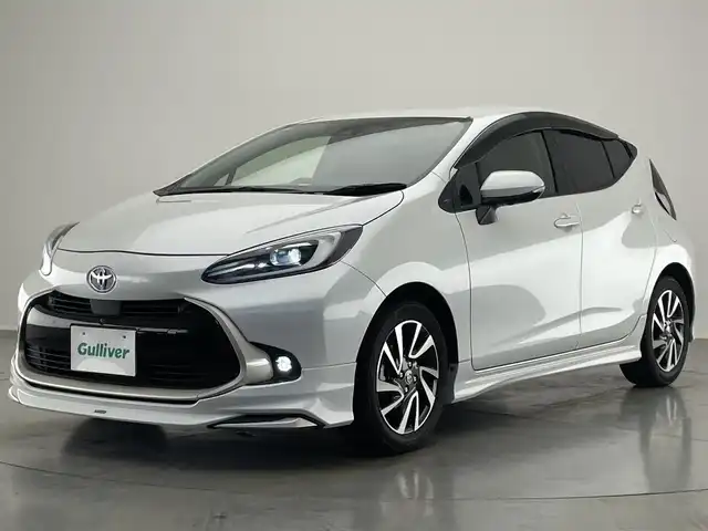 トヨタ アクア Z 愛知県 2022(令4)年 2.6万km プラチナホワイトパールマイカ 純正１０型DA　ＢＳＭ　セーフティセンス　モデリスタエアロ　禁煙　フルセグTV　衝突軽減　ｎａｎｏｅＸ　ステアリングヒーター　黒ハーフレザー　パワーシート　ＬＥＤライト　コーナーセンサー　ドラレコ　ミラキャスト　USB　Bluetooth　シートヒーター　ETC　AC100V電源